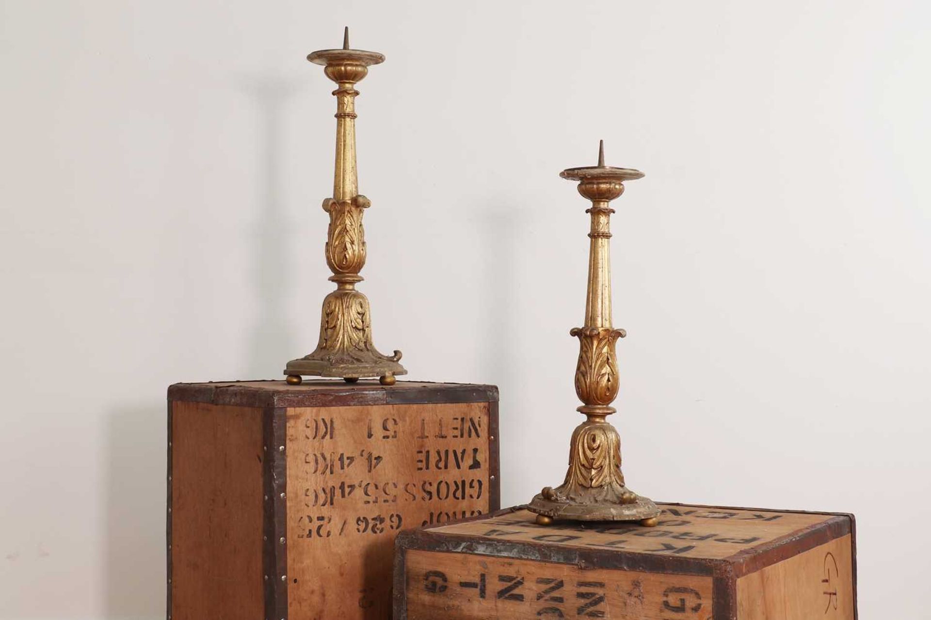 A pair of giltwood pricket candlesticks,