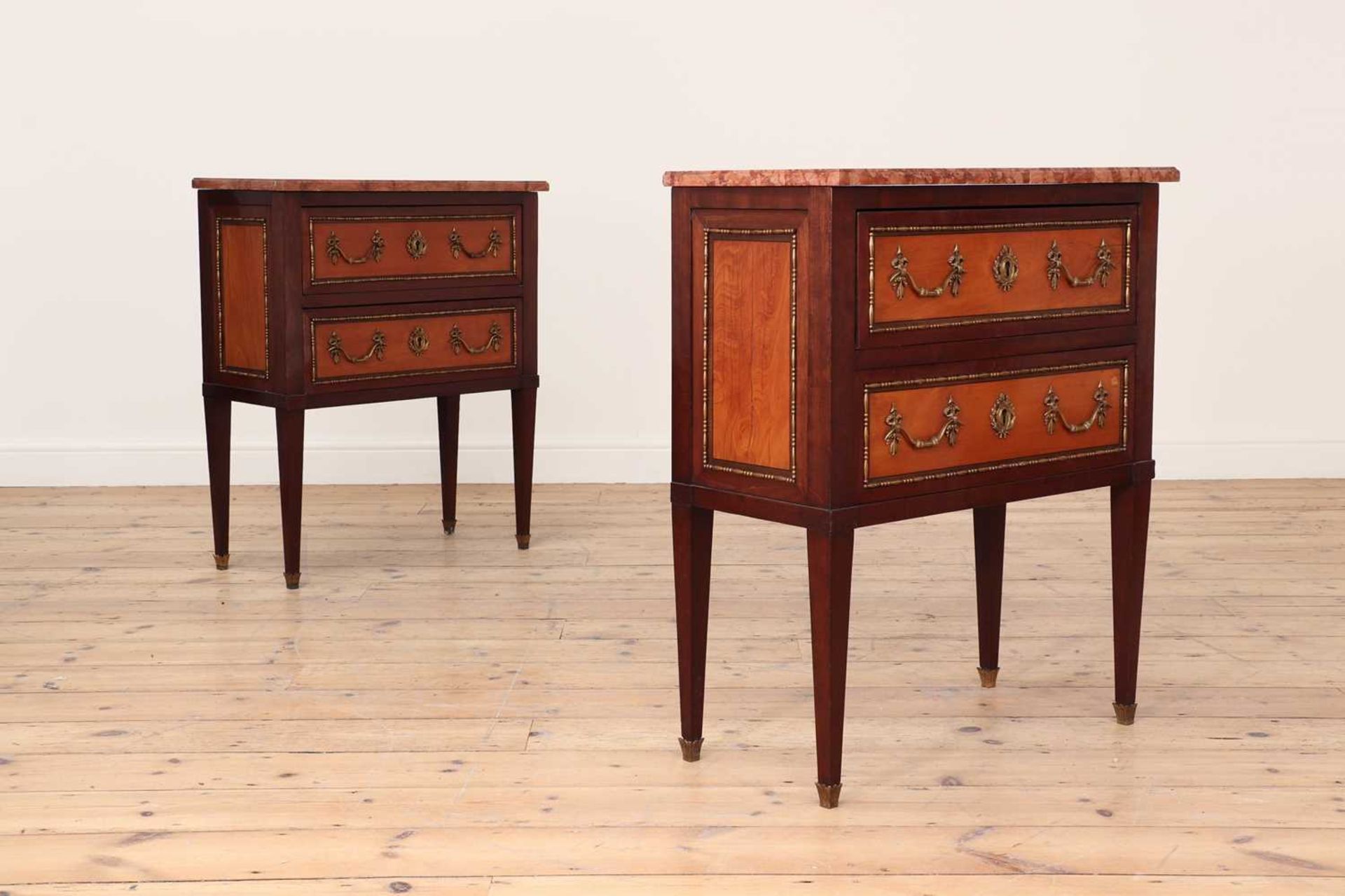 A pair of small Louis XVI-style mahogany, satinwood and gilt-metal commodes, - Bild 2 aus 5