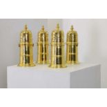 A set of four silver-gilt reproduction lighthouse sugar casters,