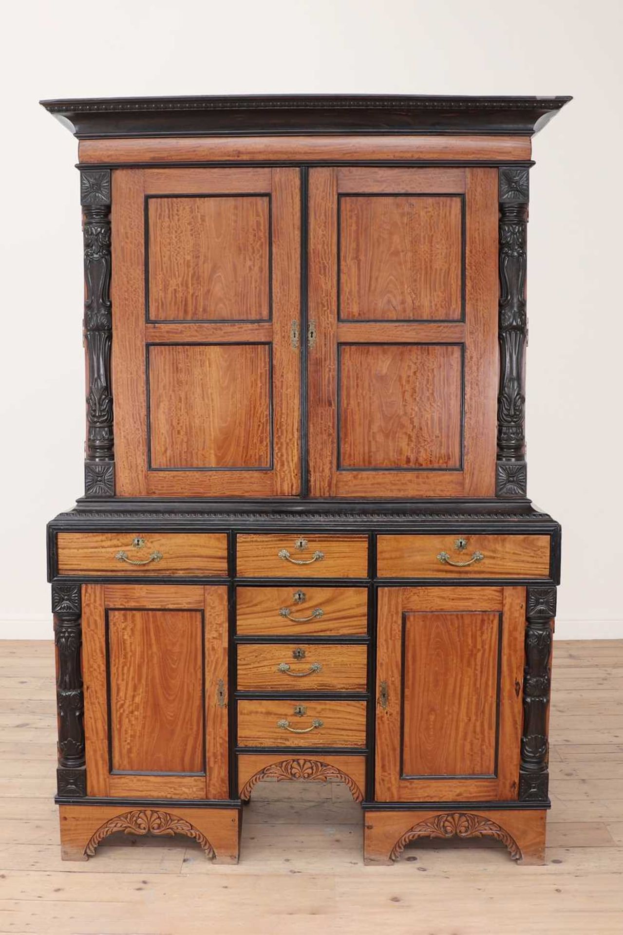 A satinwood and ebony cabinet,