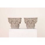 A pair of cast iron Corinthian column capitals,