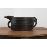 An African tribal dugout wood pouring pan,