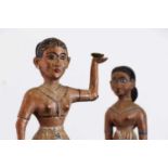 A pair of carved figures,