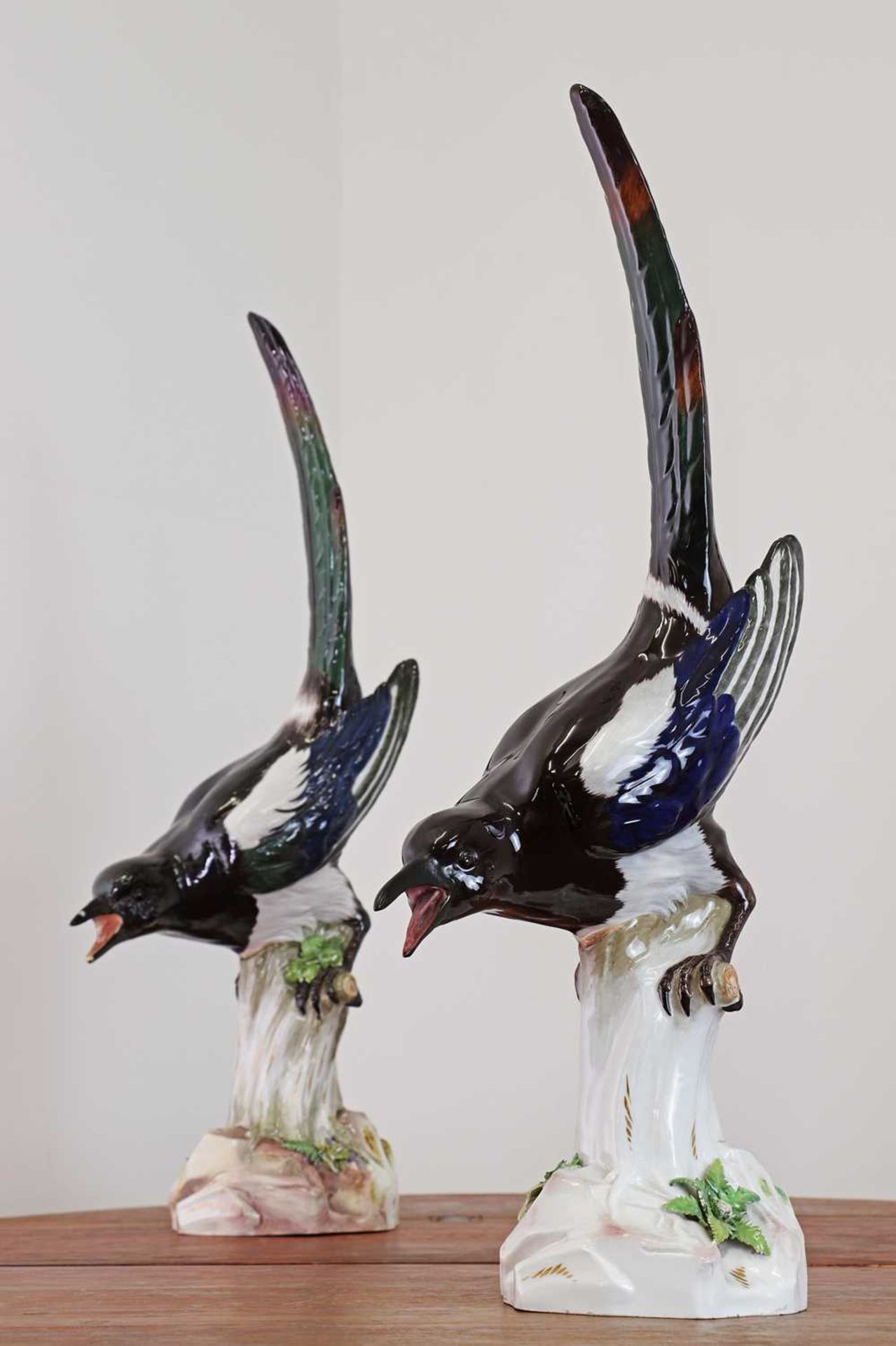 A pair of Meissen models of magpies,