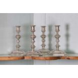 A pair of cast silver candlesticks in the 18th century-style,