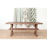 A limed oak library table,