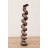 A tribal carved softwood figure of a snake,