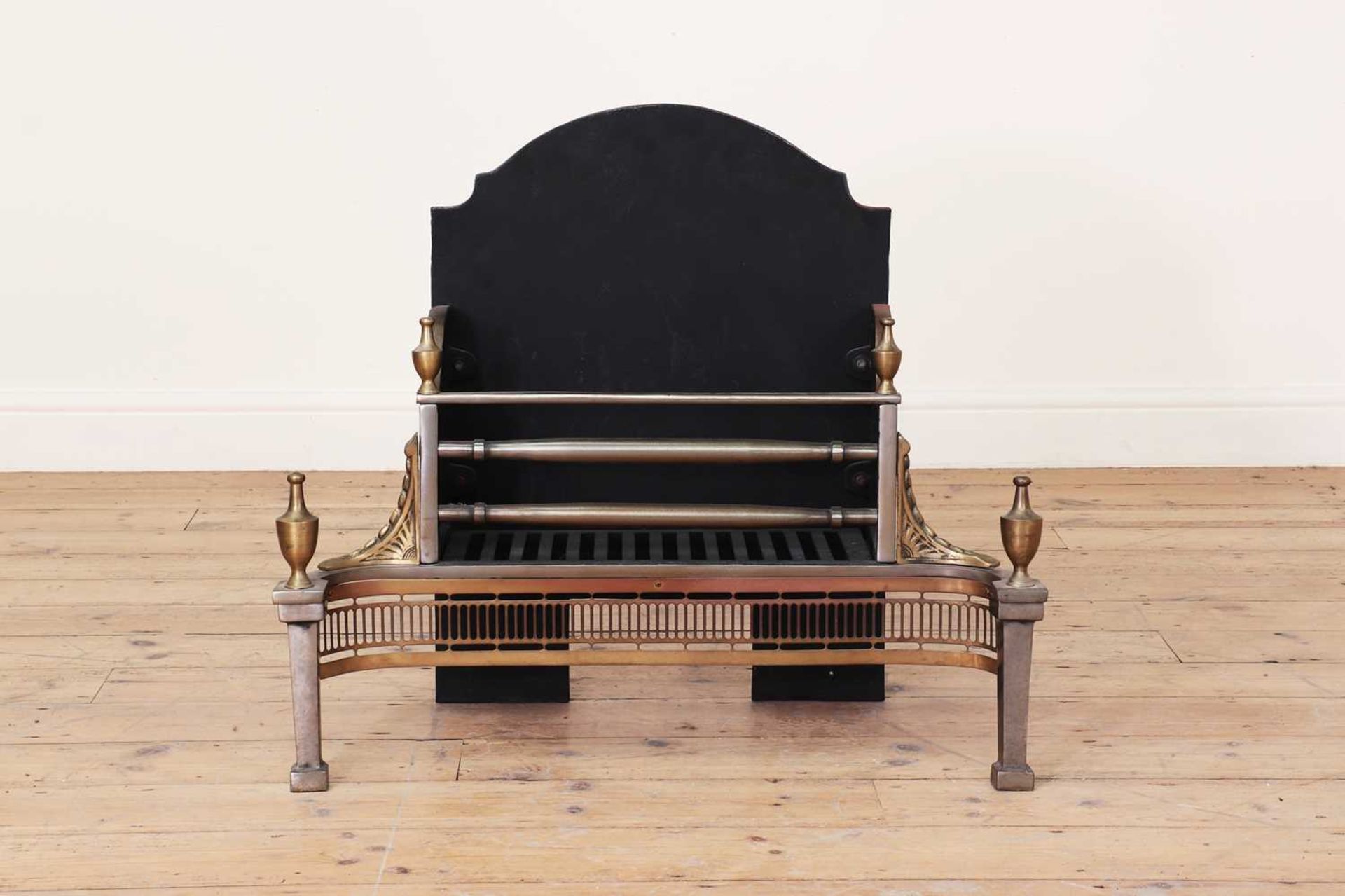 A George III-style steel fire grate,