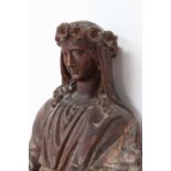 A Continental carved limewood figure of Saint Rose of Lima,