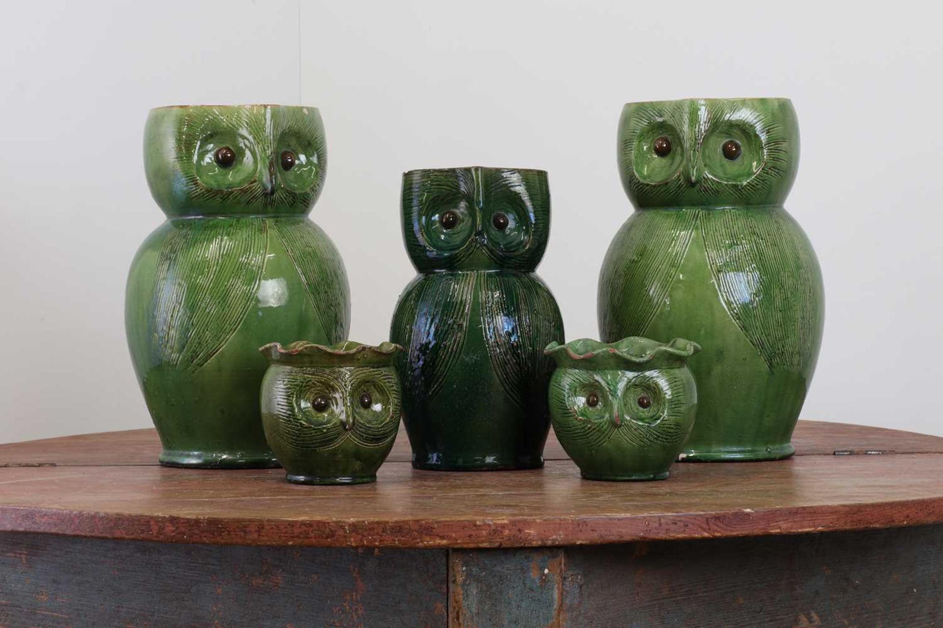 A pair of large green-glazed stoneware owl-form ewers,