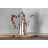 A George I silver coffee pot,