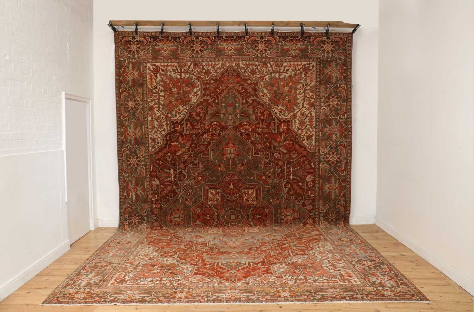 A large Persian Heriz wool carpet,
