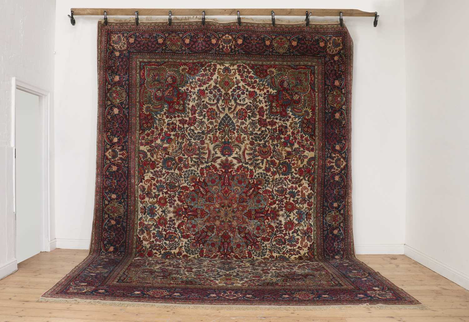 A Persian wool carpet,