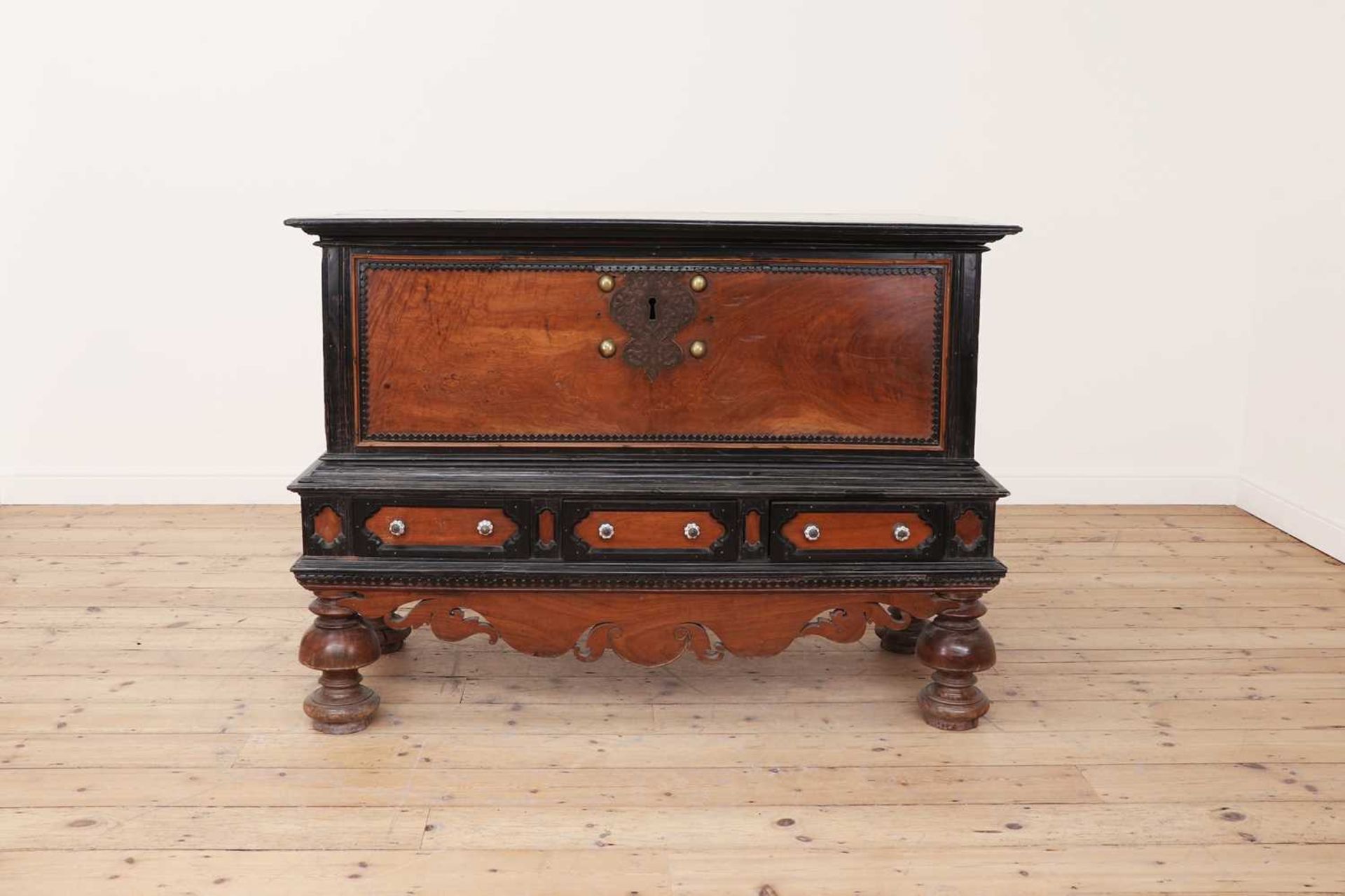 A solid satinwood and ebony chest on stand,