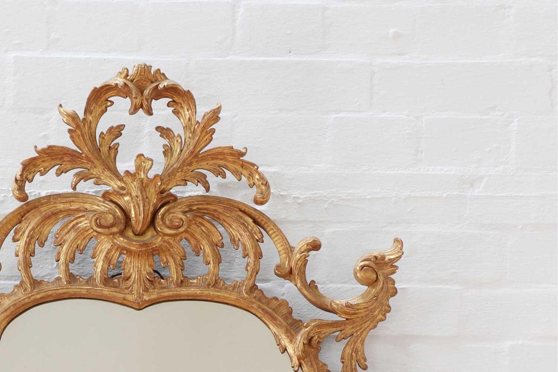 A George II giltwood mirror,