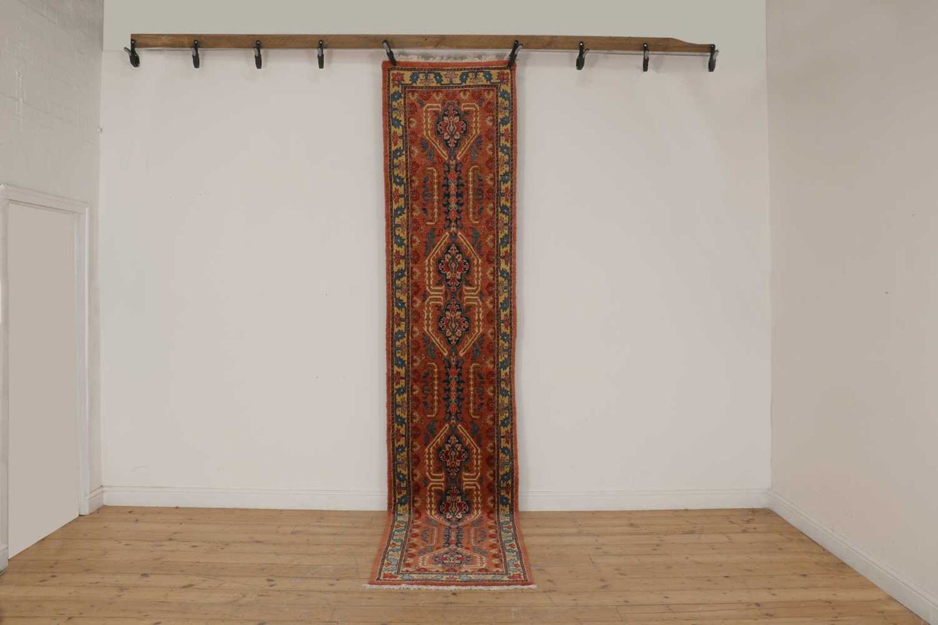 A Persian wool runner,