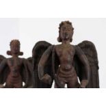 A pair of carved wooden figures of angels,