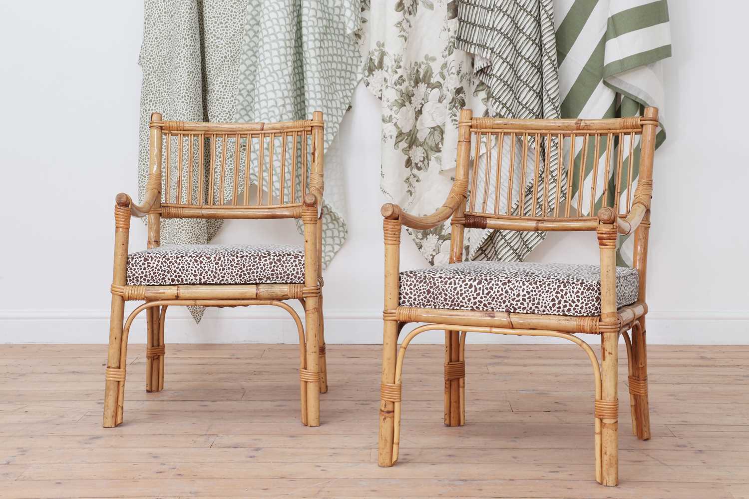 A pair of bamboo armchairs,