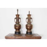 A pair of gilt-brass table lamps,