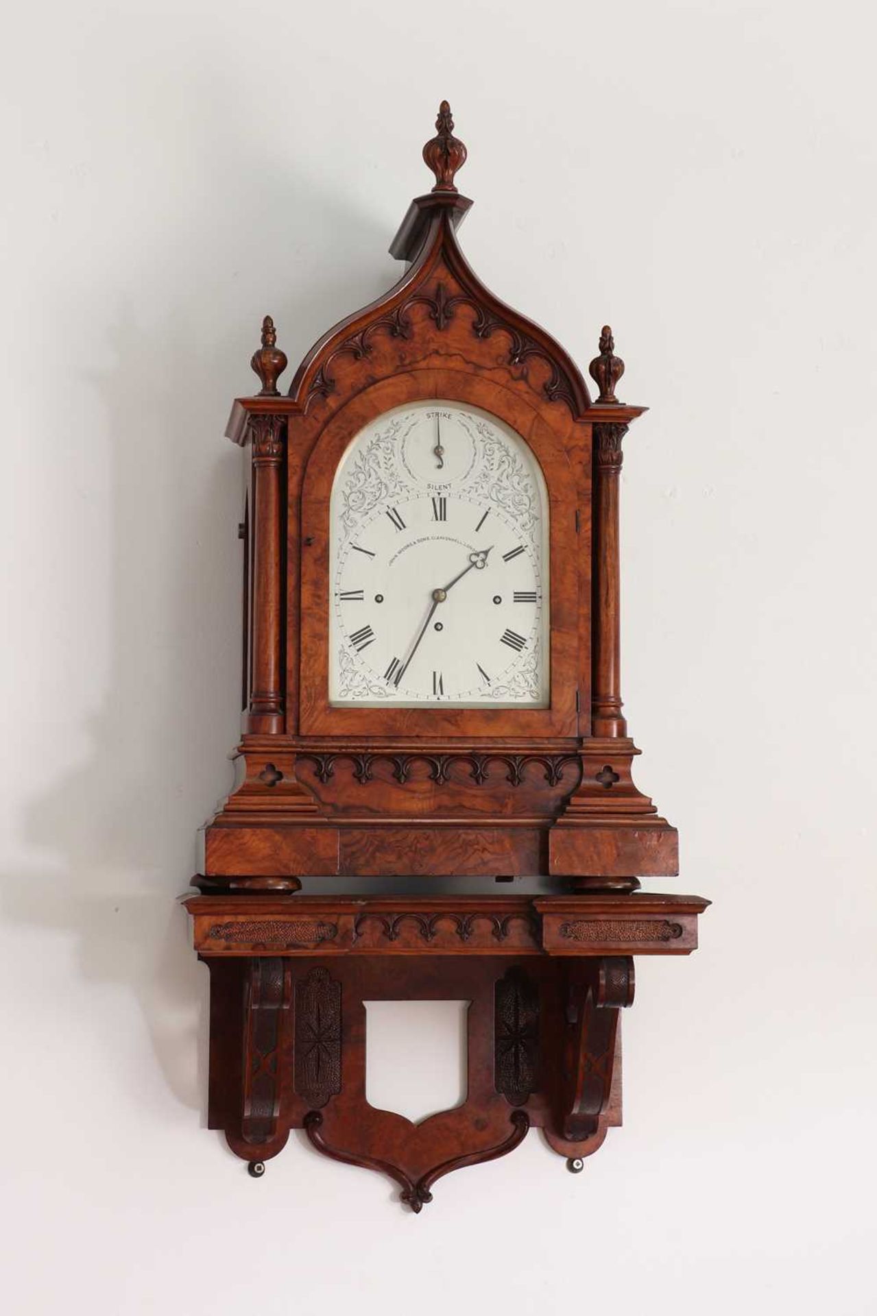 A Victorian Gothic Revival burr walnut bracket clock,