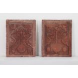 A pair of Mughal carved red sandstone panels,