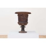 A large cast iron campagna urn,