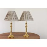 A pair of French Empire-style gilt-brass table lamps,