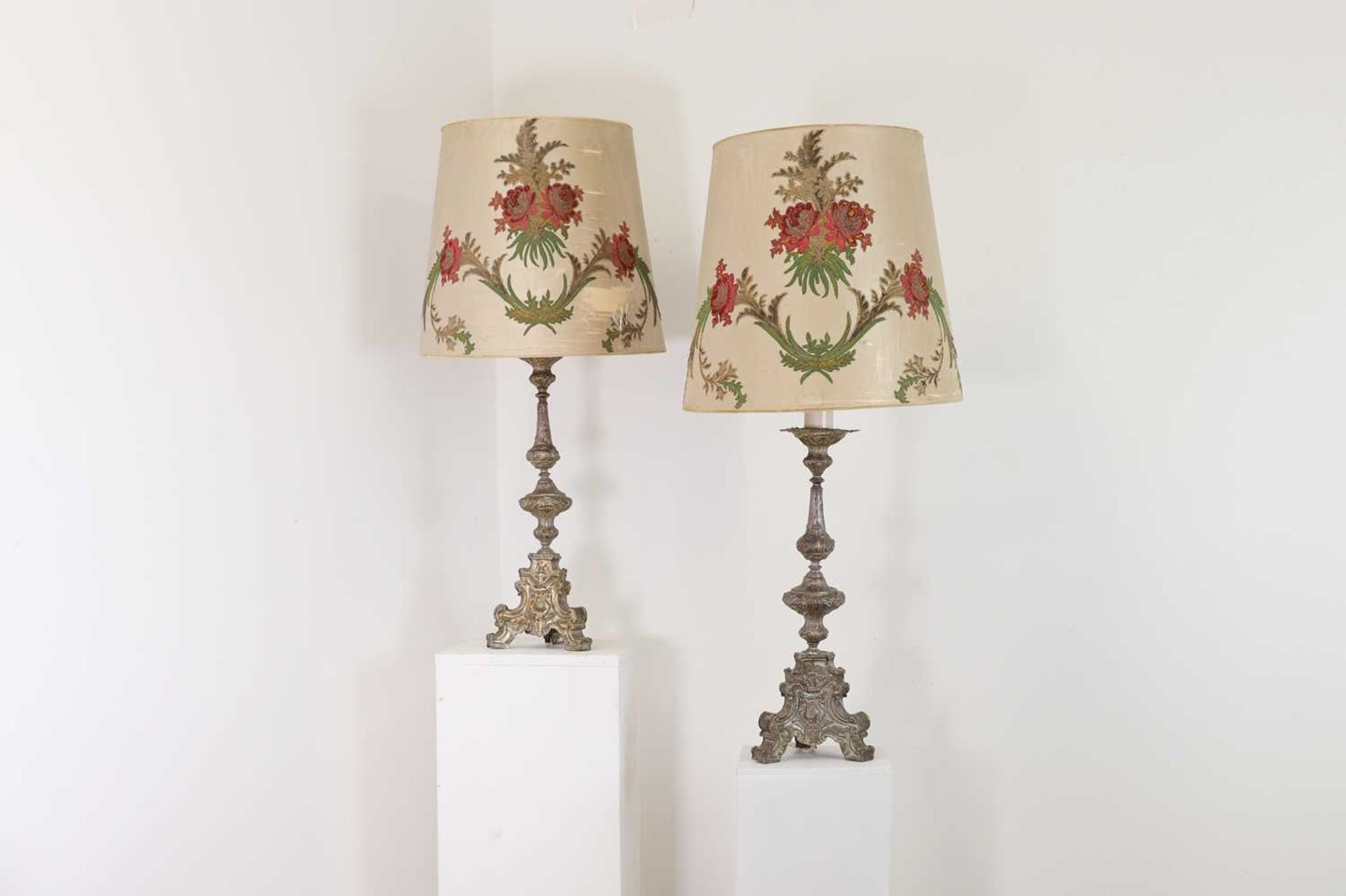 A pair of silver-plated brass altar candlestick lamps,