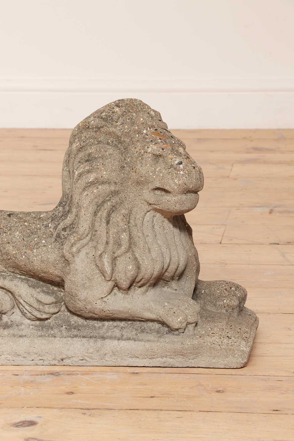 A pair of reconstituted stone recumbent lions, - Image 3 of 4