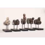 Twenty-one carved hardstone 'khunti' hangers,