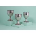 Three Georgian silver presentation stock trophies,