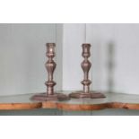 A pair of early 18th century Britannia silver candlesticks,