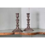 A pair of Queen Anne Britannia standard silver candlesticks,