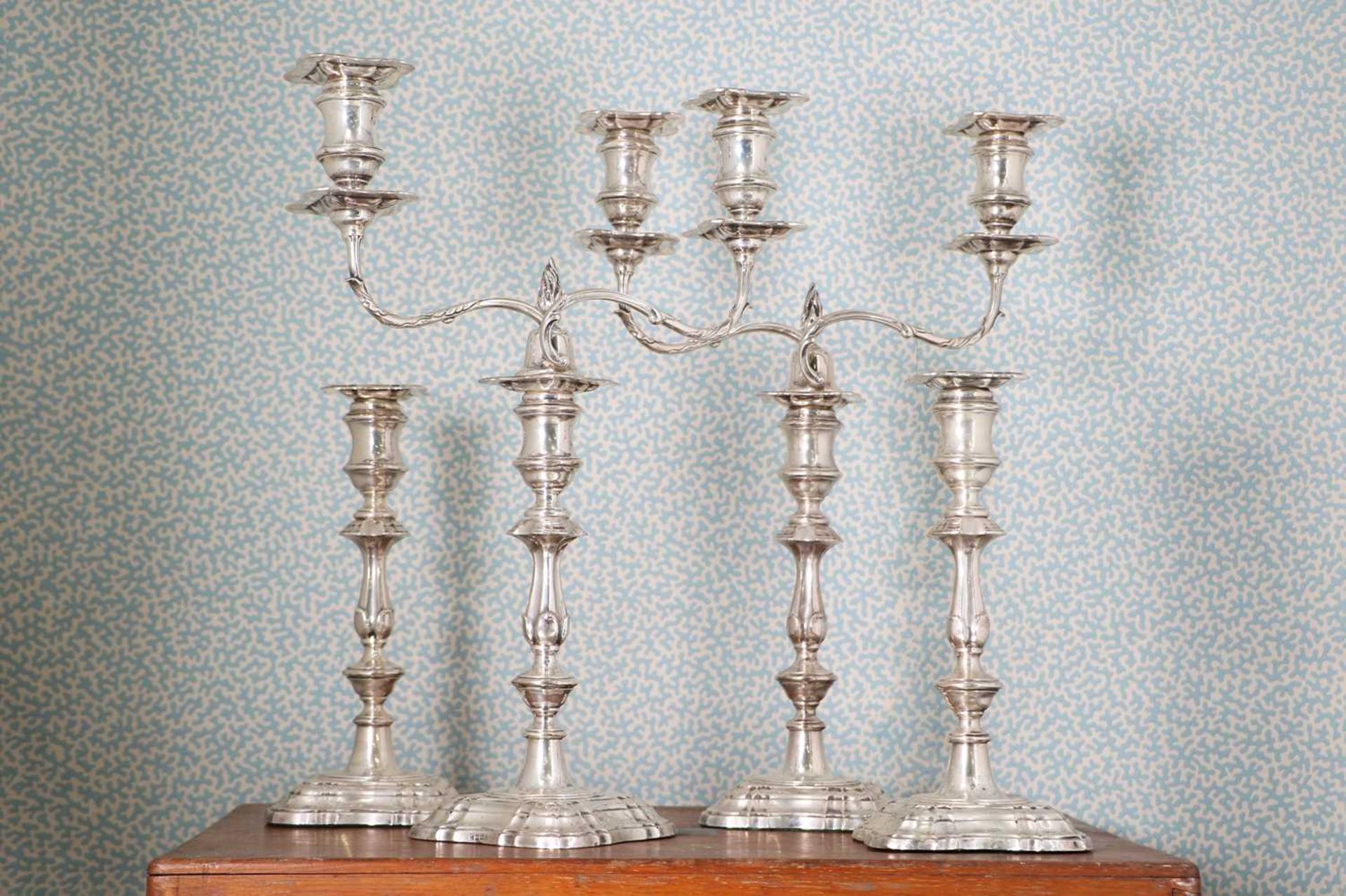 A pair of silver two-light candelabra,