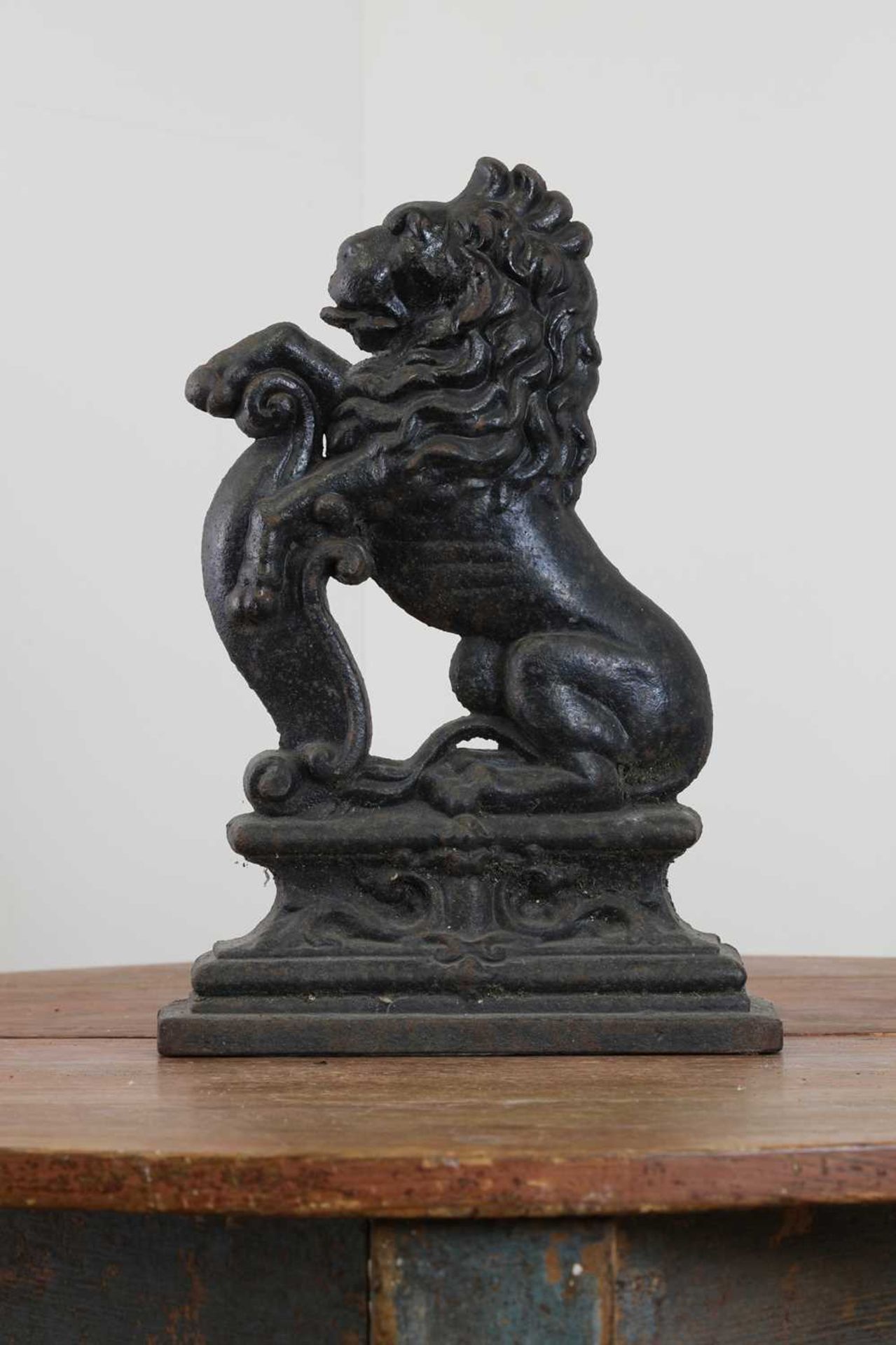 A cast iron doorstop as an heraldic lion,