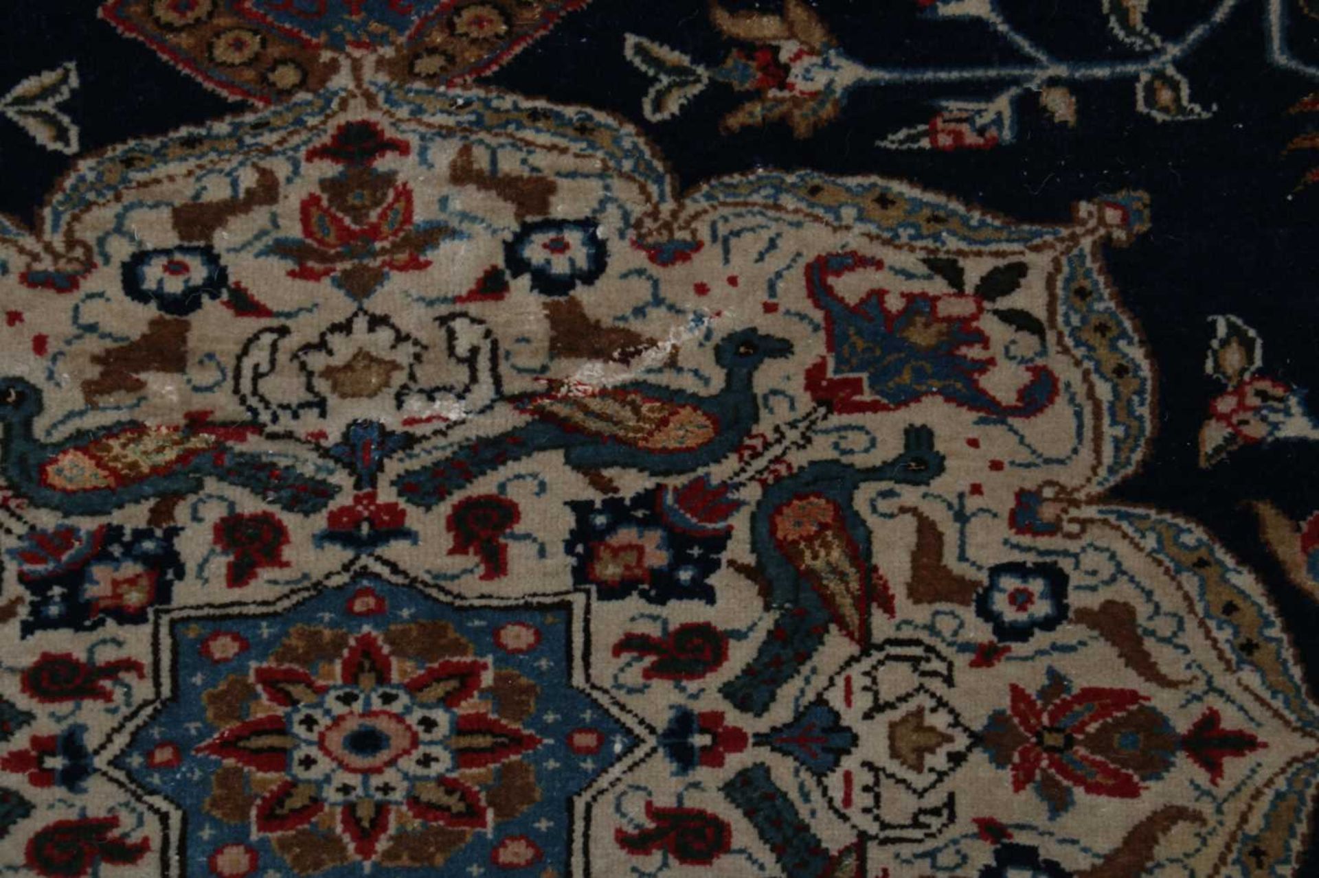 A Persian wool and silk rug, - Image 5 of 5