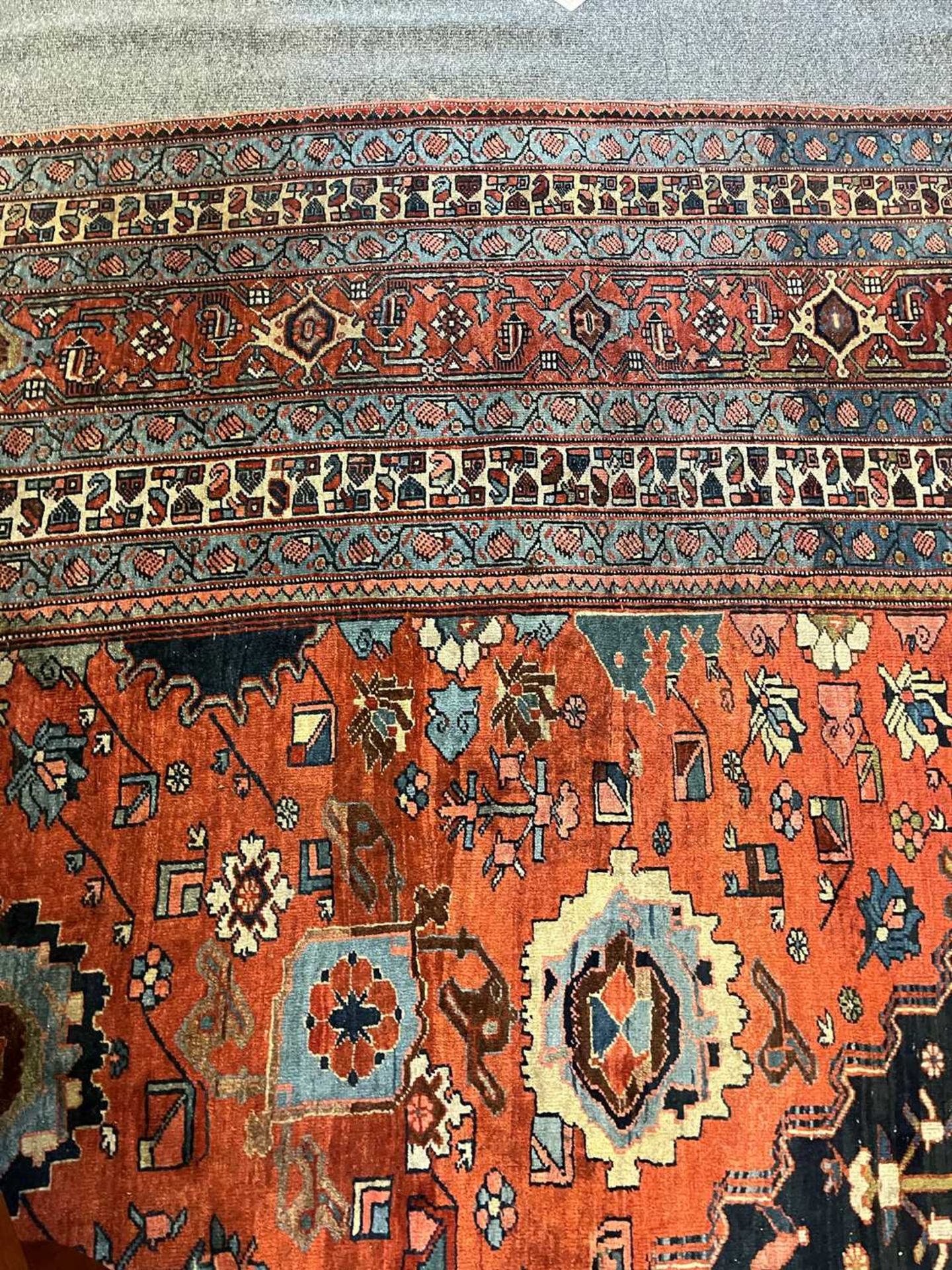 A large Persian wool carpet, - Image 6 of 28