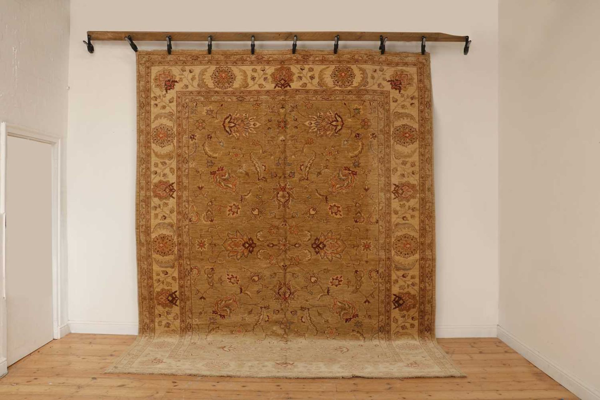 A wool carpet of Agra design,