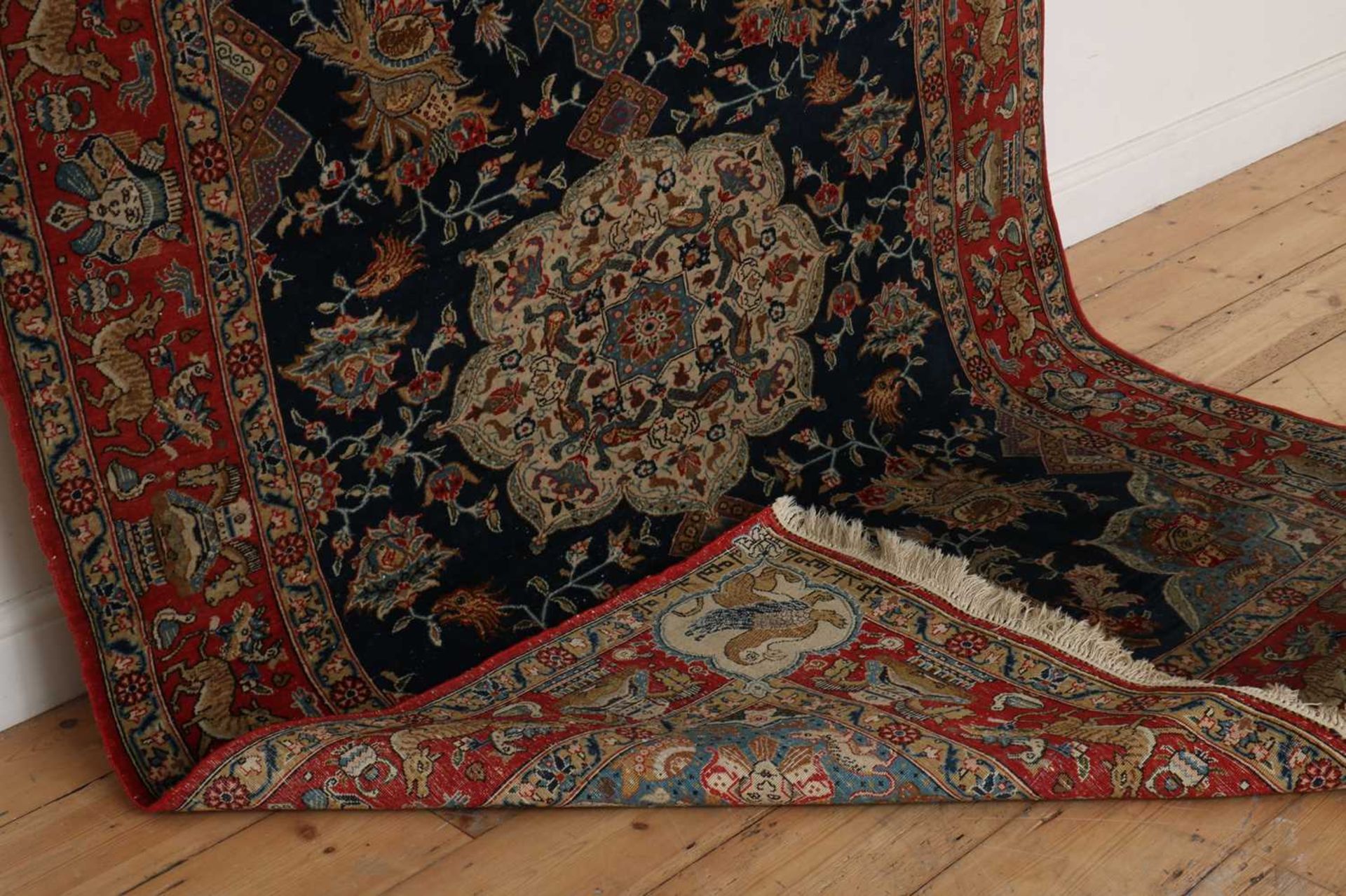 A Persian wool and silk rug, - Image 2 of 5