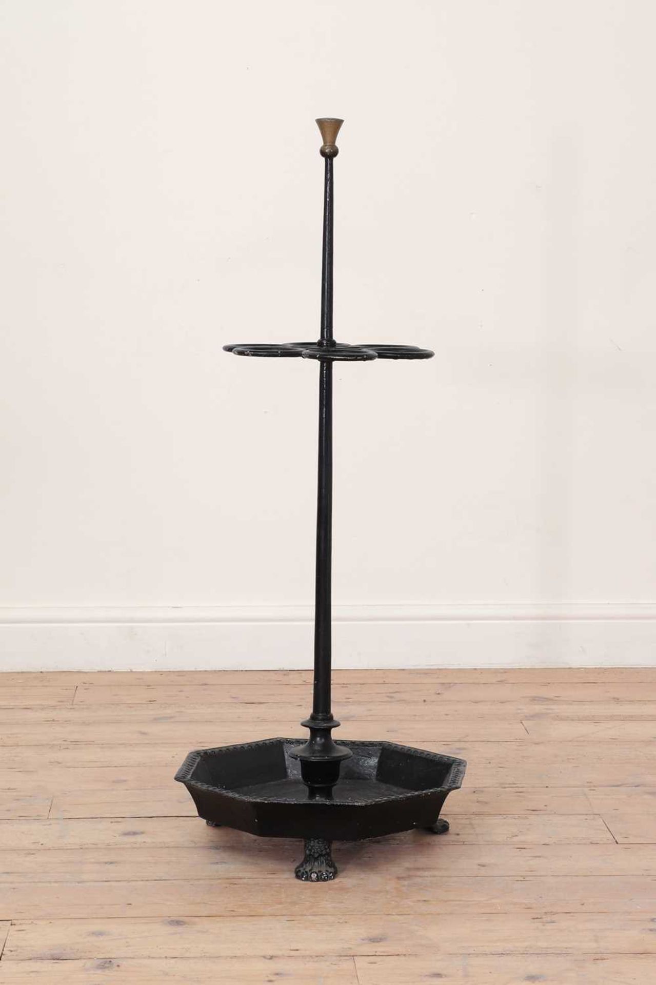 An ebonised cast iron stick stand,