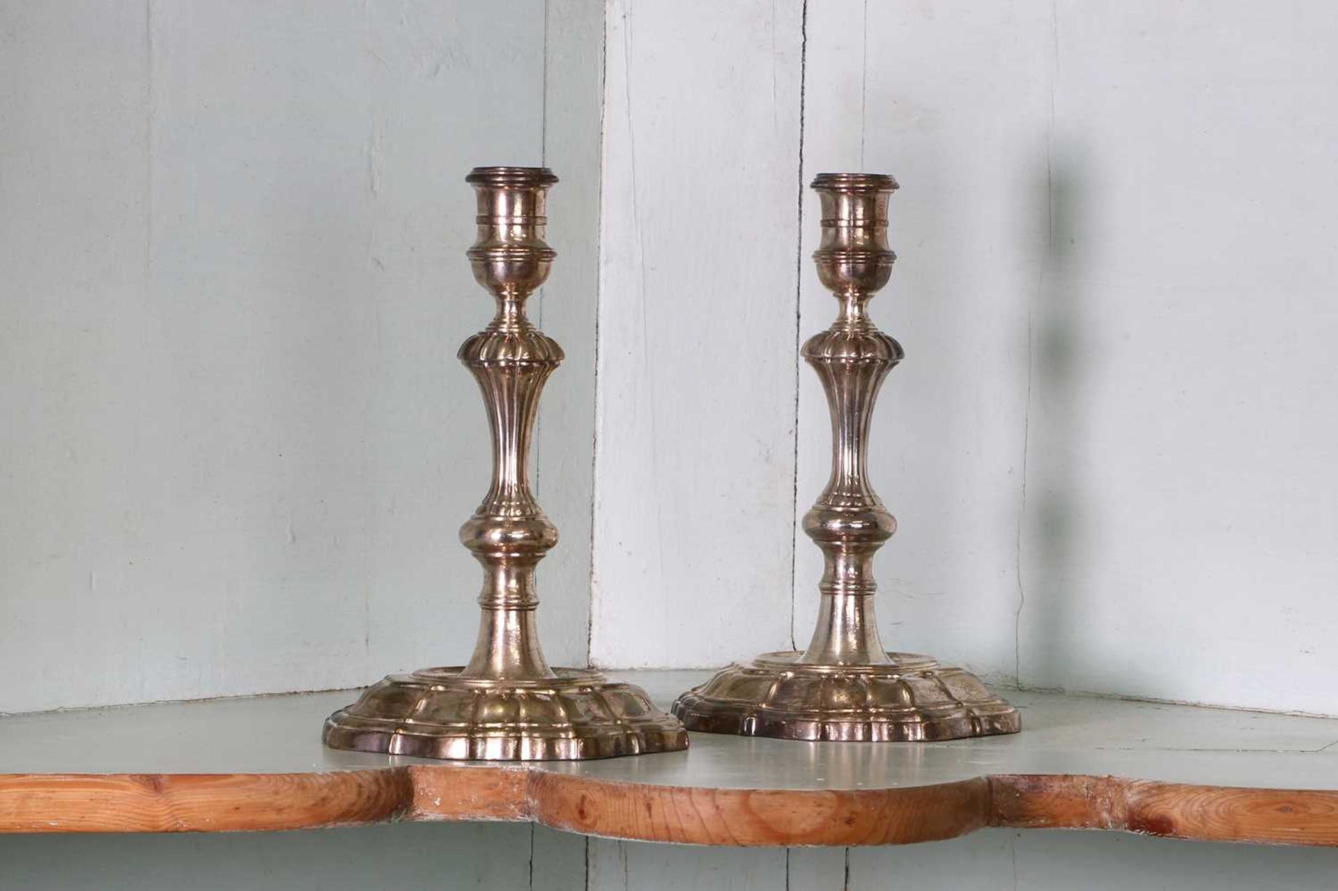 A pair of George II cast silver candlesticks, - Image 2 of 2