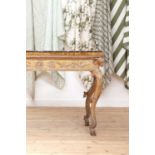 A carved giltwood console table,