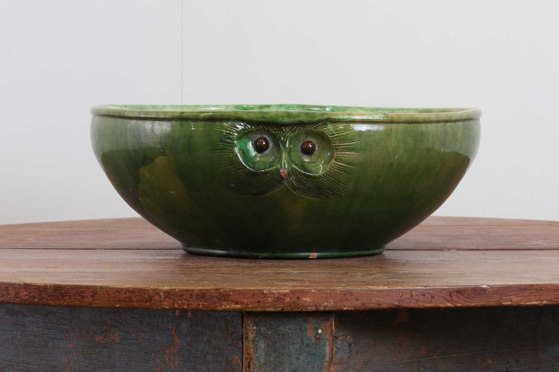 A large green-glazed stoneware owl-form bowl,