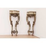 A pair of painted and parcel-gilt corner tables,