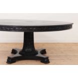 An ebonised teak dining table,