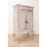 A Dutch-style limed teak and rattan cabinet on stand,