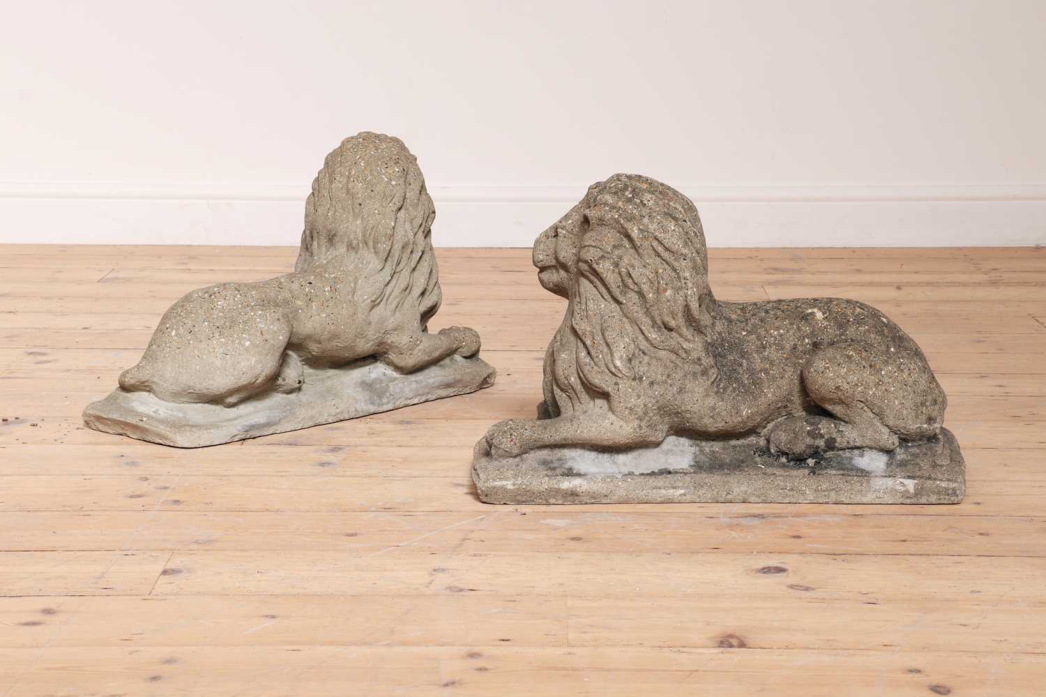 A pair of reconstituted stone recumbent lions, - Image 2 of 4