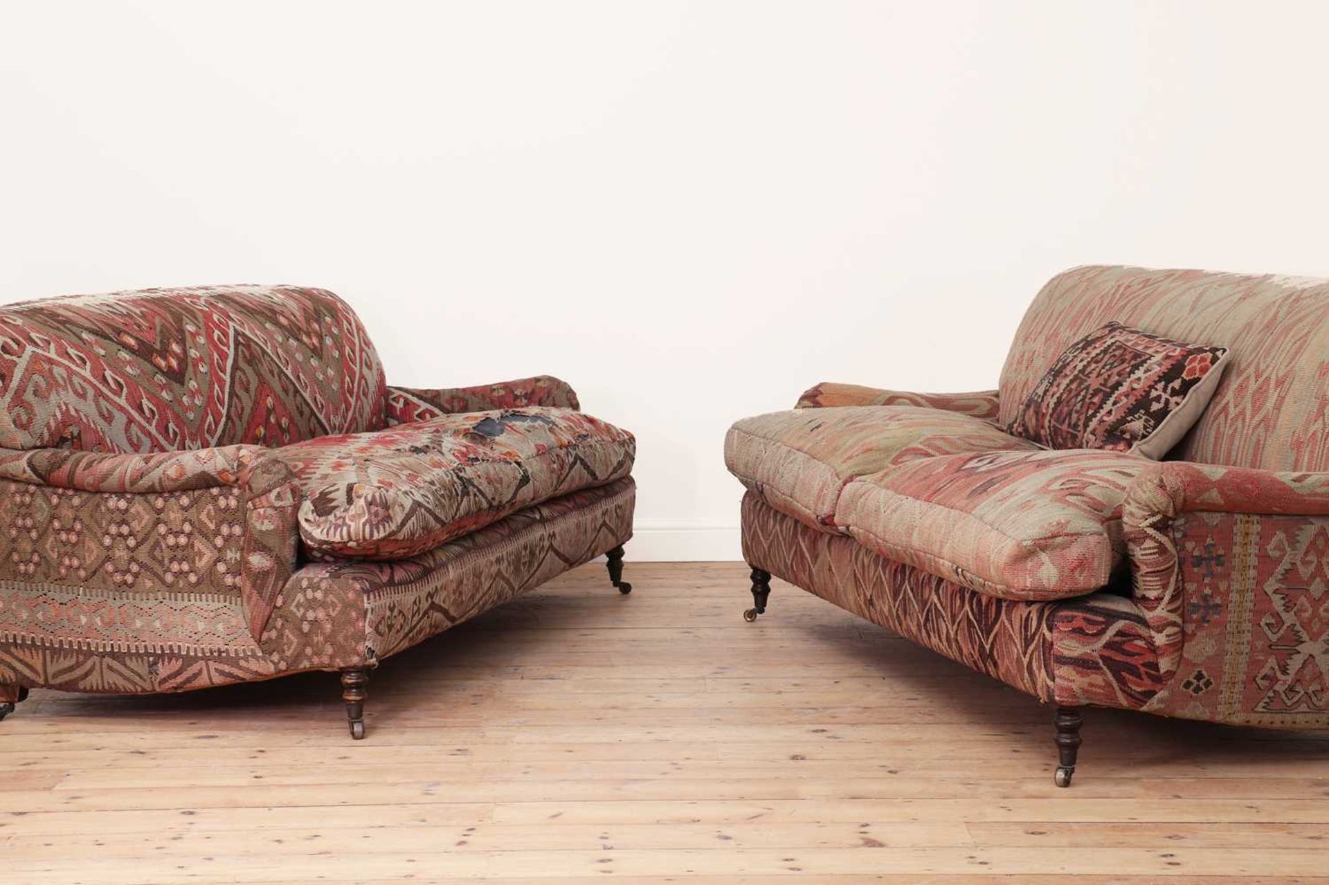 A pair of kilim-upholstered sofas,