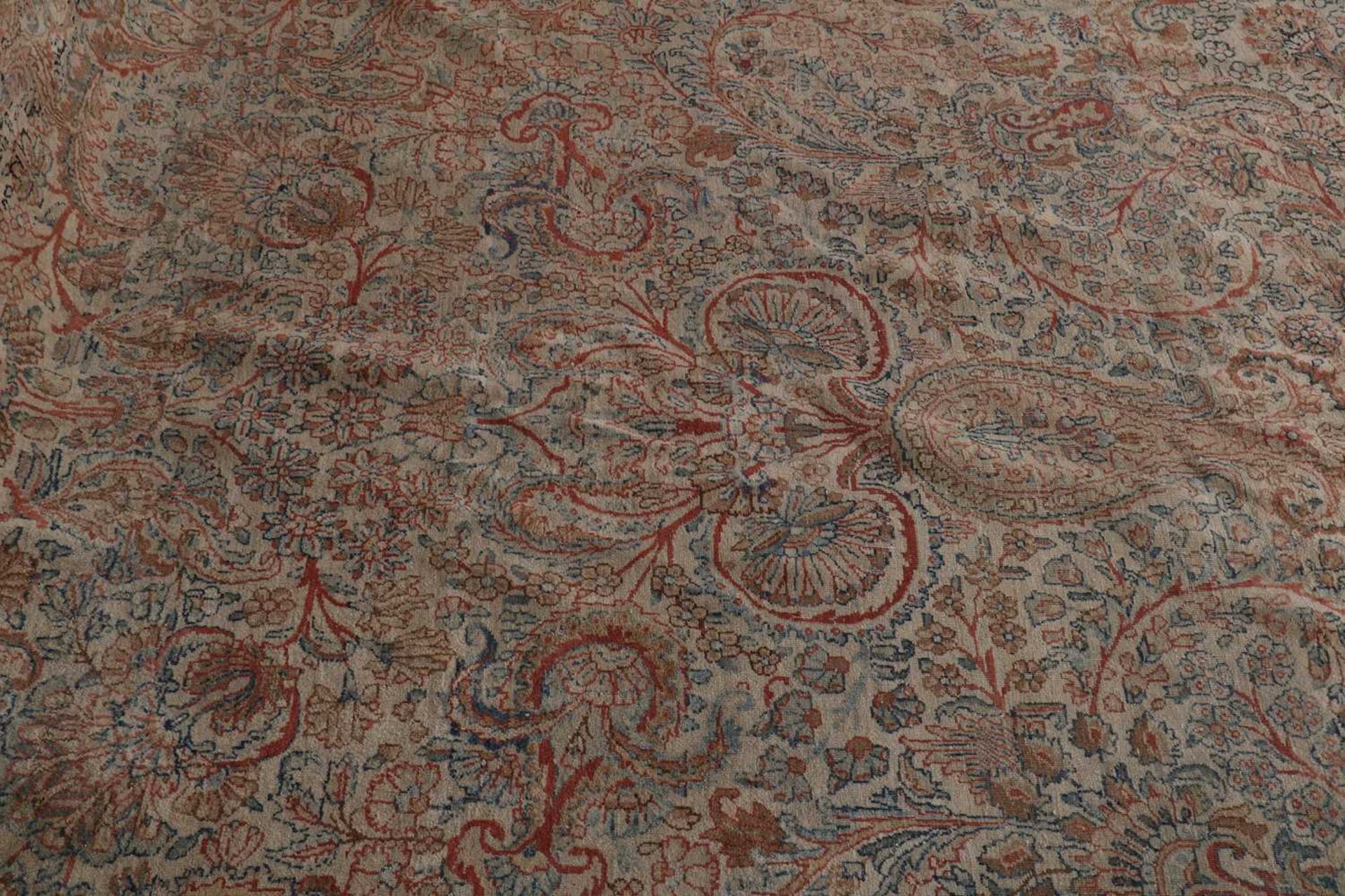 A large Persian wool carpet, - Bild 6 aus 7