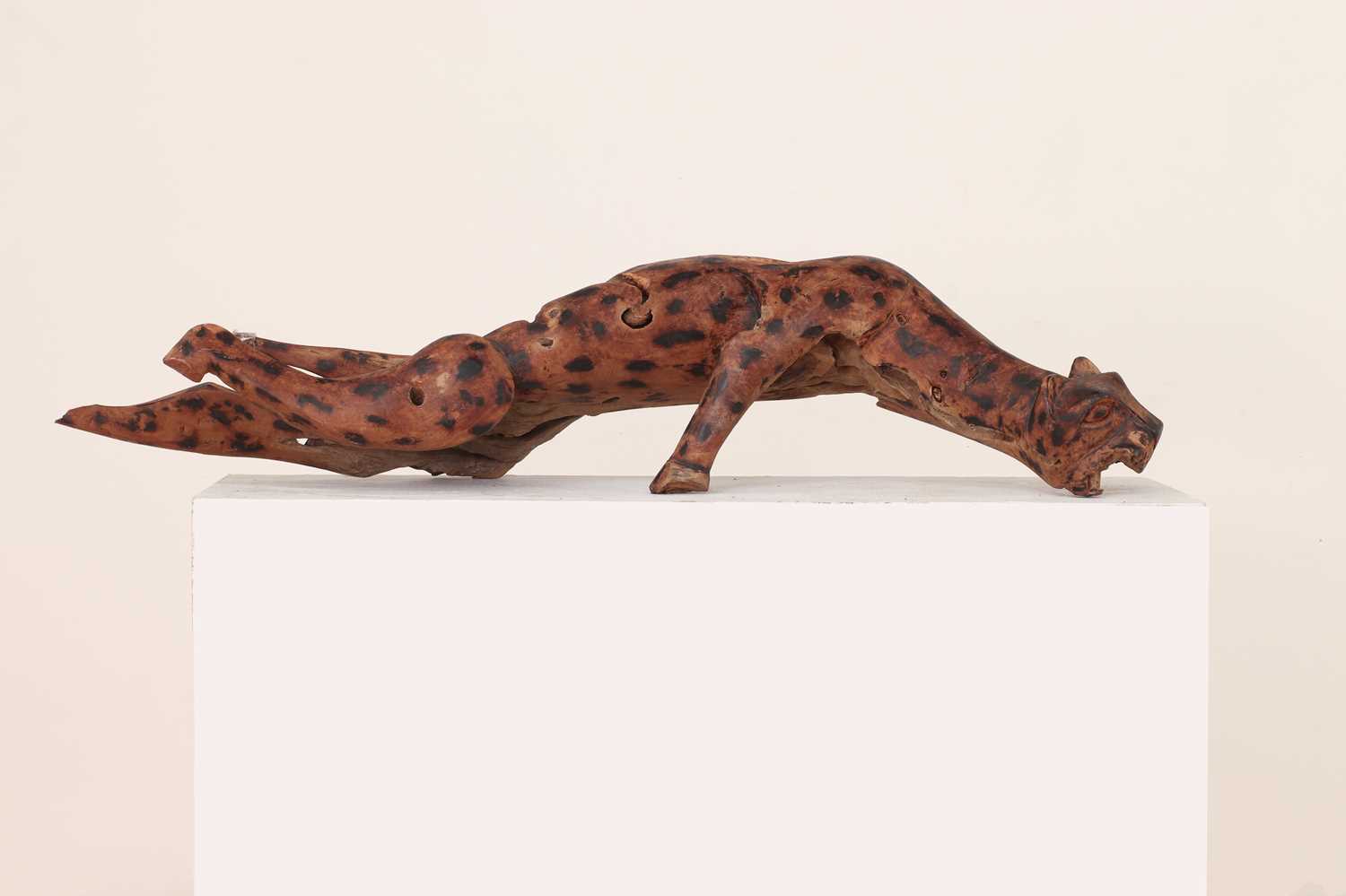 An African root carving of a leopard,